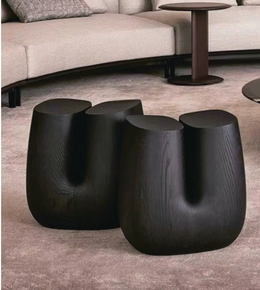 Pair of black curve side tables from Daya Worldwide featuring sleek, modern design and smooth curved edges.