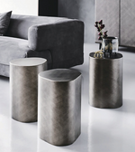 Pair of cylindrical Daya Worldwide side tables with smooth wooden finish and modern design, perfect for living room decor.