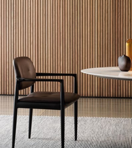 YOKO Dining Little Armchair by Daya Worldwide featuring a modern design with wooden legs and a cushioned seat.