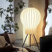 Ambient lantern floor lamp enhancing cozy living room decor