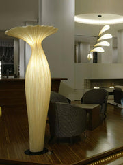 Warm glowing designer floor lamp used as accent lighting