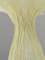Close-up of textured organic surface on sculptural floor lamp