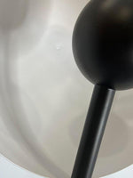 Close-up of smoked glass lampshade with warm light diffusion