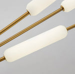 Close-up of frosted glass tube light on brass floor lamp