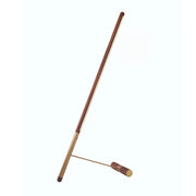 Minimalist leaning floor lamp in wood and brass on white background
