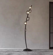 Elegant designer floor lamp creating ambient lighting in a luxury interior