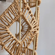 Close-up of handwoven natural fiber detailing on boho floor lamp