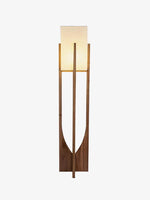 Wooden floor lamp with fabric shade isolated on white background