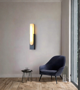 Modern marble wall light mounted in a minimalist living room