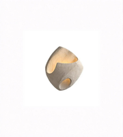 Cylindrical concrete light fixture with a warm glow on a white background