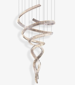 Decorative hanging sculpture with wavy design on a white background