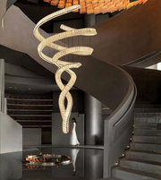 Modern chandelier hanging above a staircase in a stylish interior setting.
