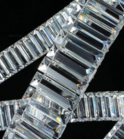 Close-up of a diamond bracelet with clear stones on a black background