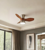 Ceiling fan with light fixture in a room with windows and a painting.