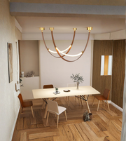 Modern dining room with a chandelier, table, and chairs.
