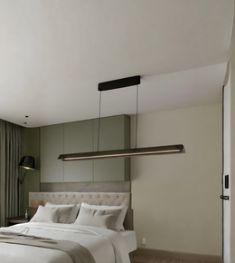 Modern bedroom with a bed and pendant light fixture.