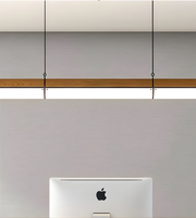 Apple device on a light gray surface with a wooden edge