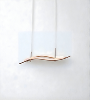 Wooden pendant light with a wavy design on a white background