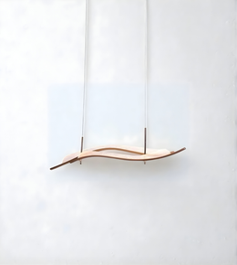 Wooden pendant light with a wavy design on a white background