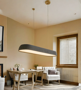 Modern dining room with a pendant light fixture, table, chairs, and a window.