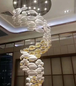 Modern chandelier with spherical design in a room setting