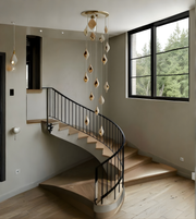 Modern staircase with decorative pendant lights in a home interior.
