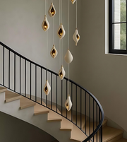 Modern staircase with decorative pendant lights in a home setting