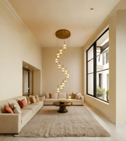 Modern living room with beige sofa, coffee table, and decorative pillows.