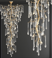 Decorative chandeliers with branch-like design and hanging crystals on a dark background