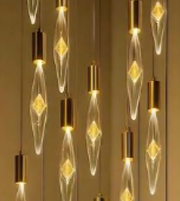 Decorative light bulbs with gold bases on a neutral background