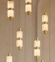 Chandelier with multiple light fixtures on a neutral background