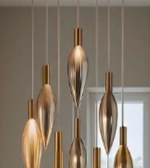 Gold pendant lights hanging from a ceiling