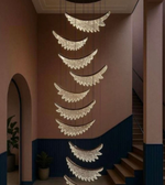 Decorative ceiling light fixture in a room with pink and blue walls.
