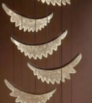 Decorative mirror with lace-like edges on a wooden background