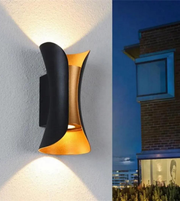 Modern outdoor wall light fixture on a building exterior.