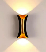 Modern wall light fixture with a geometric design on a plain background