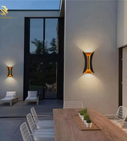 Modern outdoor setting with wall lights on a building exterior