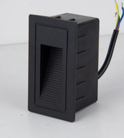 Black rectangular electronic component with wiring on a white background