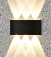Modern wall-mounted light fixture on a concrete wall