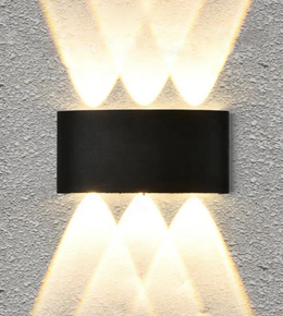 Modern wall-mounted light fixture on a concrete wall