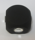 Black hexagonal object with a central circular cutout on a white background