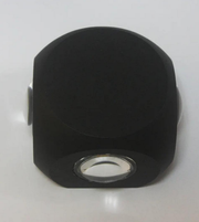 Black hexagonal object with a central circular cutout on a white background