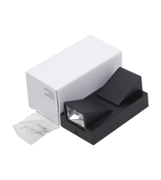 Black and white photo printer with a roll of film on a white background