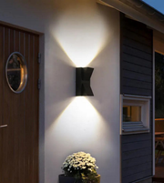 Modern outdoor wall light fixture on a house exterior