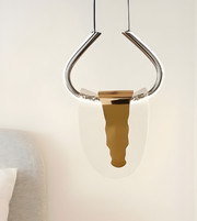 Modern pendant light with a metallic shade on a neutral background