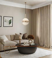 Modern living room with a beige sofa, black coffee table, and pendant light.
