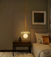 Nestled corner of a bedroom with a side table and bed.