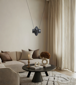 Modern living room with a beige sofa, coffee table, and decorative items.