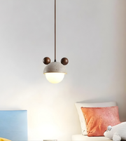 Modern pendant light fixture in a room with a neutral color scheme.