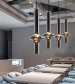 Modern interior design with pendant lights over a meeting room.